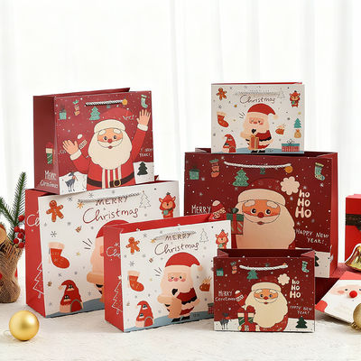 कस्टम आकार मुद्रित क्राफ्ट क्रिसमस बैग रिबन हैंडल के साथ लक्जरी उपहार बैग